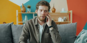 Worried man talking on the phone
